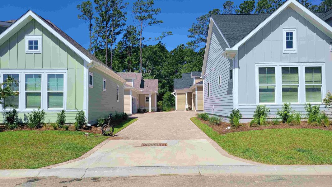 Front exterior of a new home in Nexton – Midtown – The Garden Collection, Summerville, SC, highlighting curb appeal (Image 2).