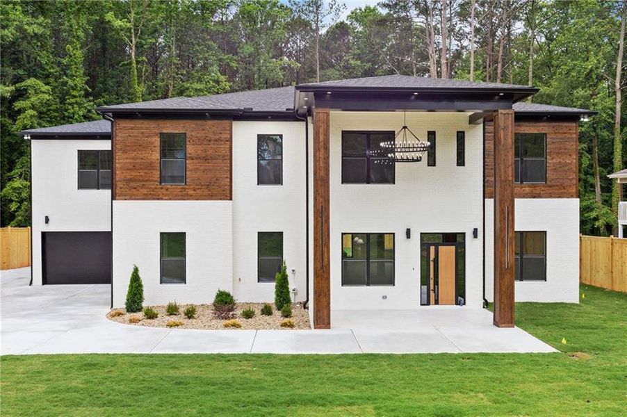 Front exterior of a new home in , Lilburn, GA, highlighting curb appeal (Image 33).