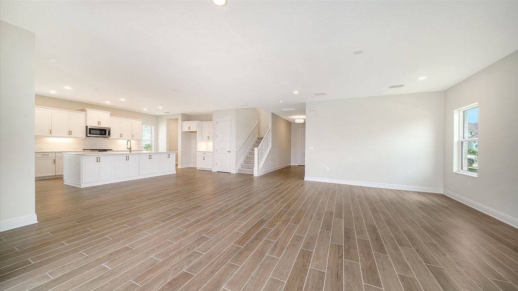 Spacious, unfurnished interior of a new home in Palm Grove Real Estate and Homes for Sale in Lakewood Ranch, FL - Neal Communities, Bradenton (Image 7).