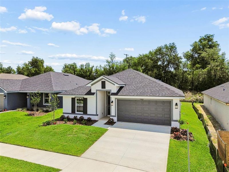 Front exterior of a new home in Abbey Glen, Dade City, FL, highlighting curb appeal (Image 38). Front exterior of a new home in Abbey Glen, Dade City, FL, highlighting curb appeal (Image 38).