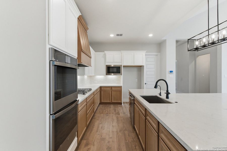 Furnished interior view inside a new home in Potranco Oaks, Castroville (Image 19).