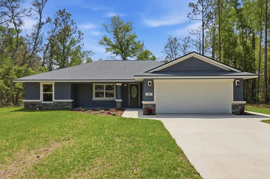 Front exterior of a new home in , Dunnellon, FL, highlighting curb appeal (Image 2). Front exterior of a new home in , Dunnellon, FL, highlighting curb appeal (Image 2).