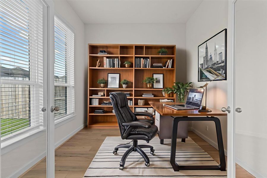 Virtually Staged – Home office setup in the study showcases space for productivity with natural light and flexible design options.