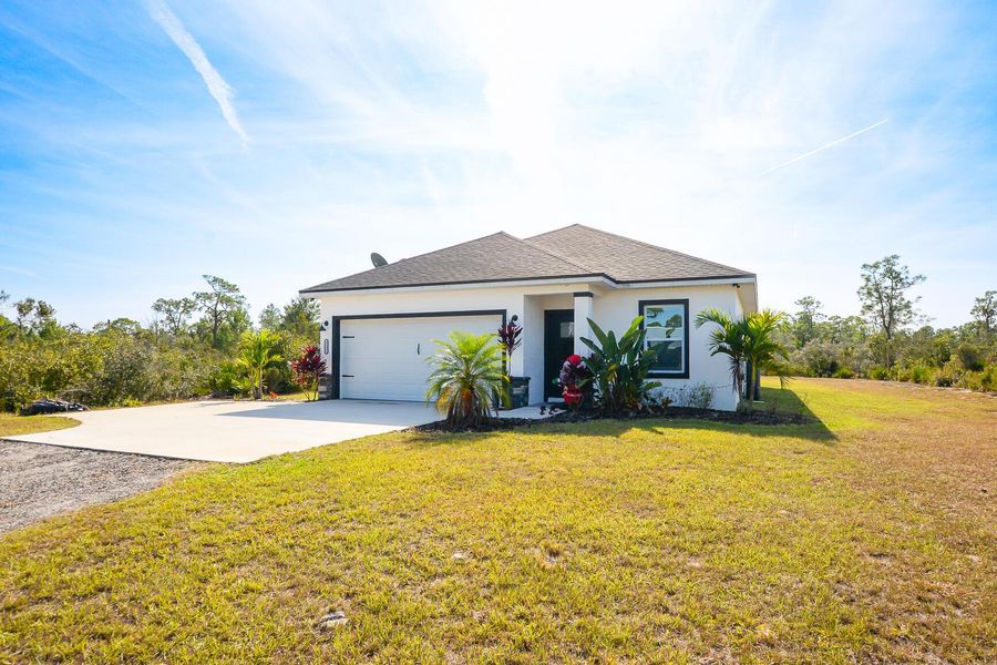 Front exterior of a new home in , Sebring, FL, highlighting curb appeal (Image 1).