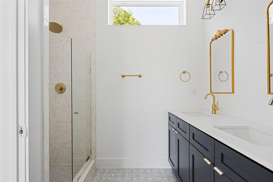 Full bath with a stall shower and double vanity Full bath with a stall shower and double vanity