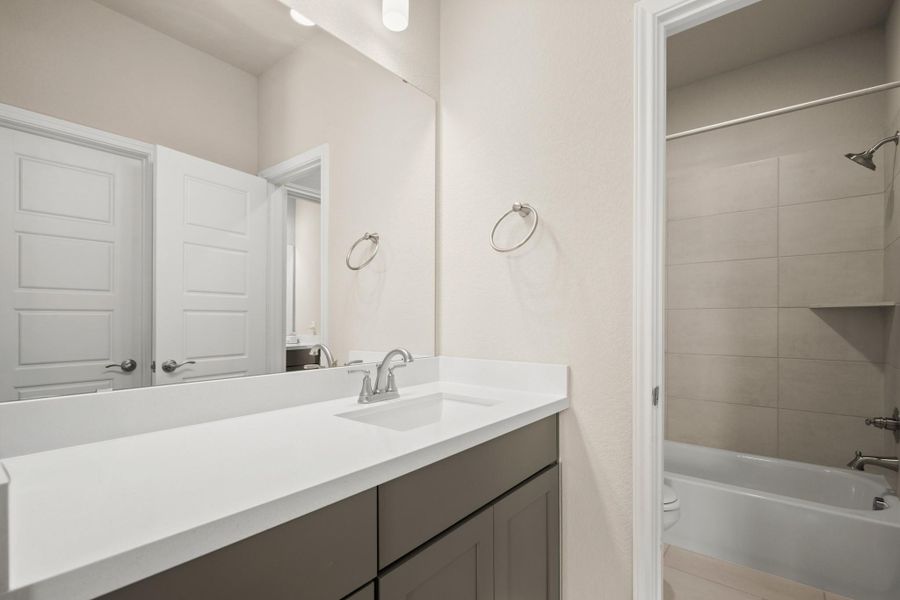 Full bath featuring vanity and bathtub / shower combination Full bath featuring vanity and bathtub / shower combination