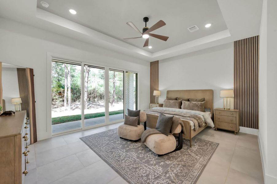 The private primary suite is a tranquil retreat, featuring serene views, soft natural light, and a layout designed for rest and relaxation.