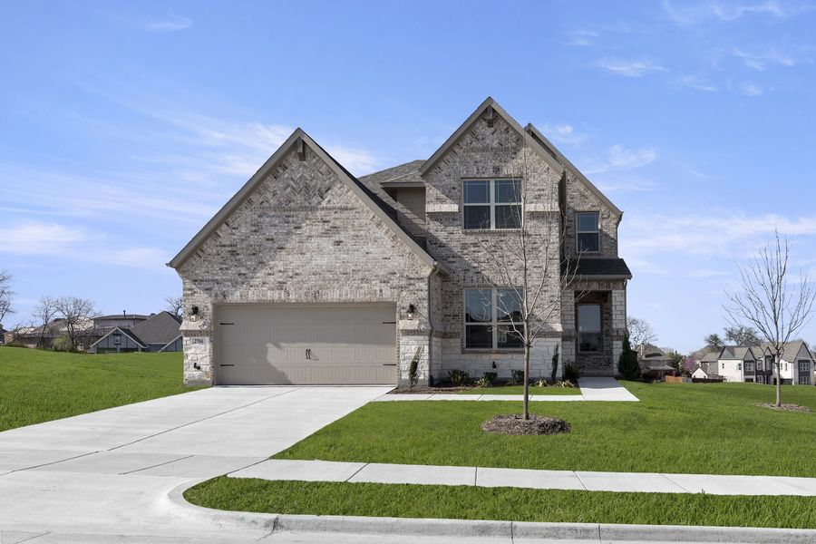 Front exterior of a new home in Providence Cove, McKinney, TX, highlighting curb appeal (Image 1). Front exterior of a new home in Providence Cove, McKinney, TX, highlighting curb appeal (Image 1).