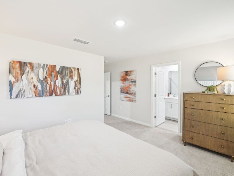 Primary bedroom in the Topaz floorplan at a Meritage Homes community in Mebane, NC.