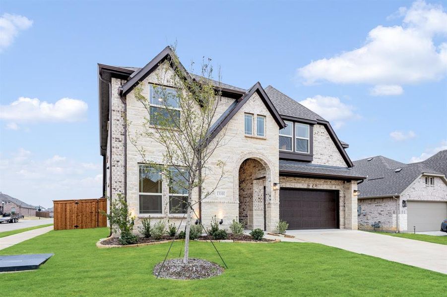 Front exterior of a new home in Woodstone, Providence Village, TX, highlighting curb appeal (Image 19). Front exterior of a new home in Woodstone, Providence Village, TX, highlighting curb appeal (Image 19).