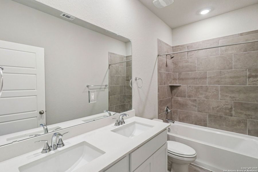 Furnished interior view inside a new home in Estancia Ranch - Premier Series, San Antonio (Image 11).