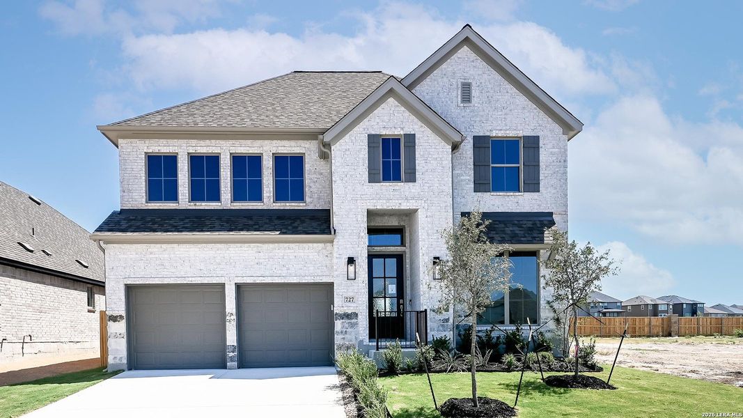 Front exterior of a new home in Legacy at Lake Dunlap, New Braunfels, TX, highlighting curb appeal (Image 17). Front exterior of a new home in Legacy at Lake Dunlap, New Braunfels, TX, highlighting curb appeal (Image 17).