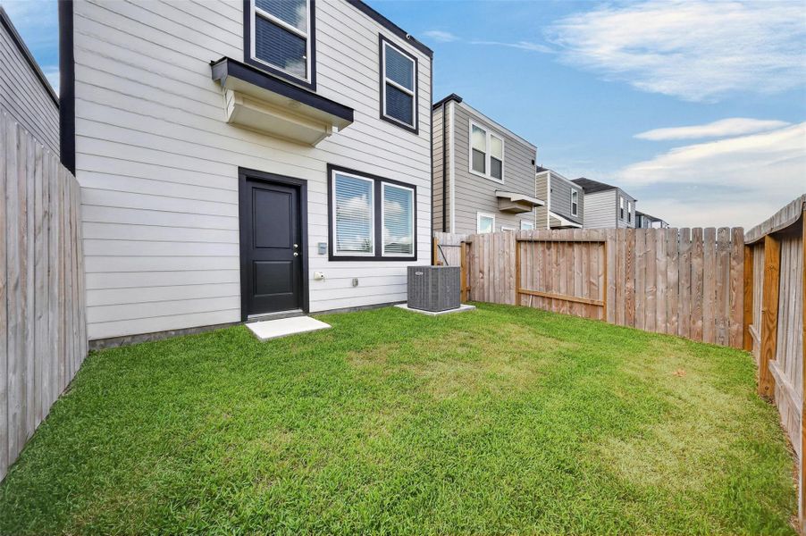 Exterior details and patio area of a home in The Villas at Legacy Park, Houston (Image 3).