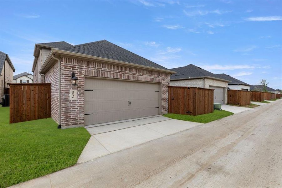 Front exterior of a new home in Cambridge Crossing, Celina, TX, highlighting curb appeal (Image 2).