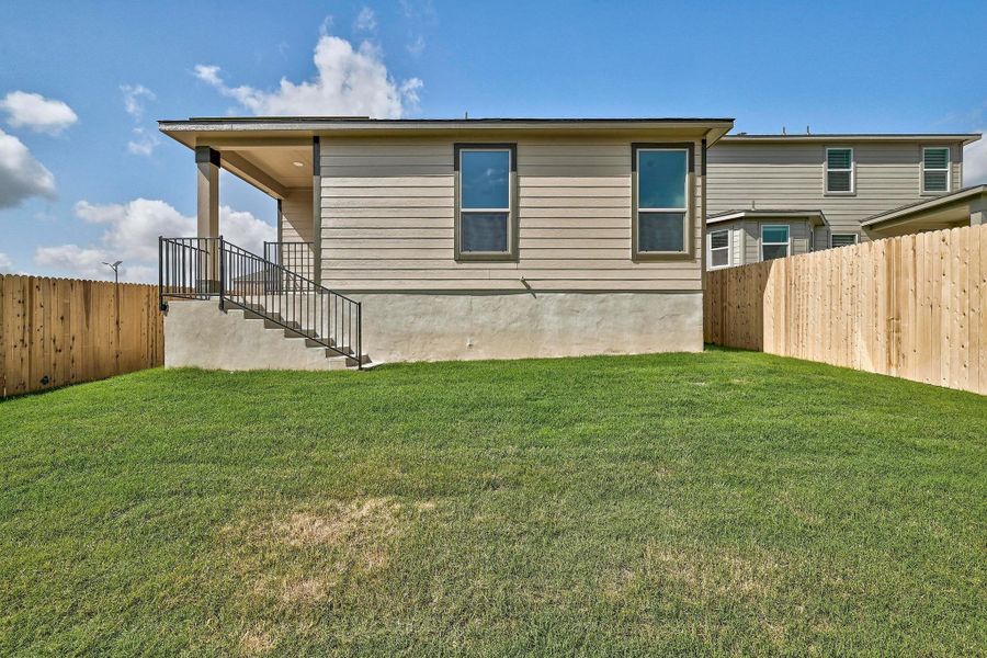 Front exterior of a new home in Creekside at Estancia, Austin, TX, highlighting curb appeal (Image 16).