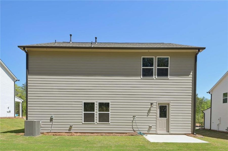 Exterior details and patio area of a home in The Pointe at Heron Bay, Locust Grove (Image 4).