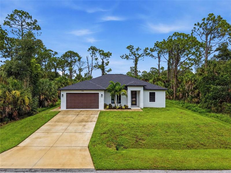 Front exterior of a new home in , Port Charlotte, FL, highlighting curb appeal (Image 23).
