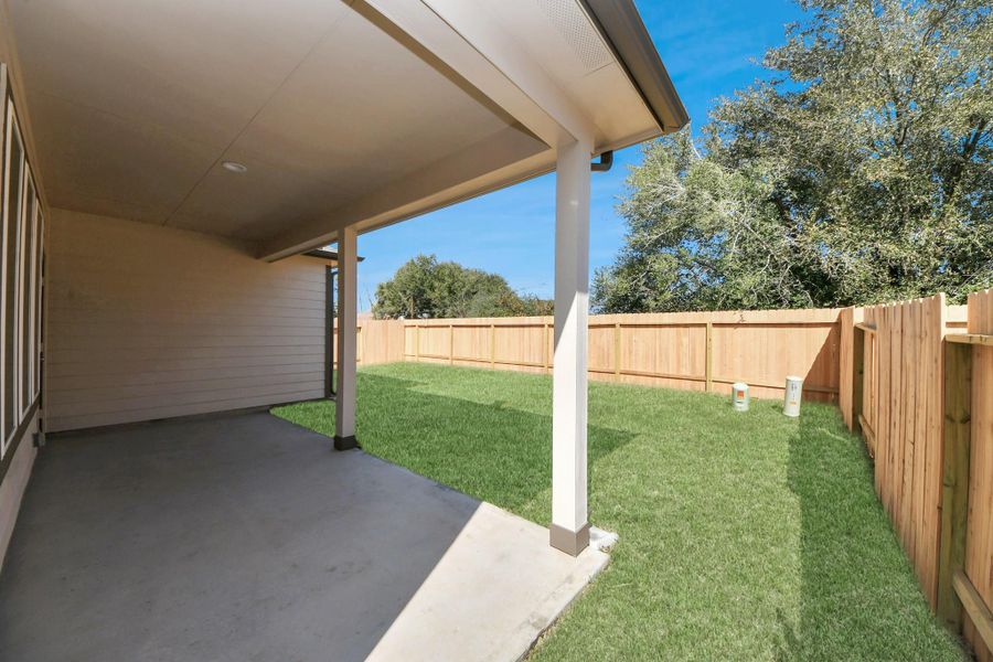 Experience outdoor living at its finest on this expansive covered patio, thoughtfully designed for BBQs and delightful outdoor dining