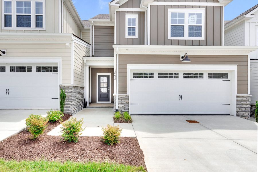 Front exterior of a new home in Harvest Point, Spring Hill, TN, highlighting curb appeal (Image 2). Front exterior of a new home in Harvest Point, Spring Hill, TN, highlighting curb appeal (Image 2).