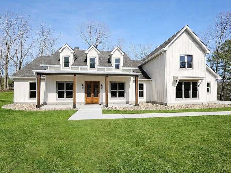 Front exterior of a new home in , Ball Ground, GA, highlighting curb appeal (Image 24).
