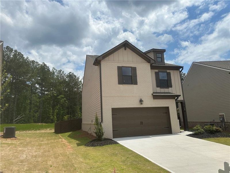 Front exterior of a new home in Kentmere, Auburn, GA, highlighting curb appeal (Image 25).