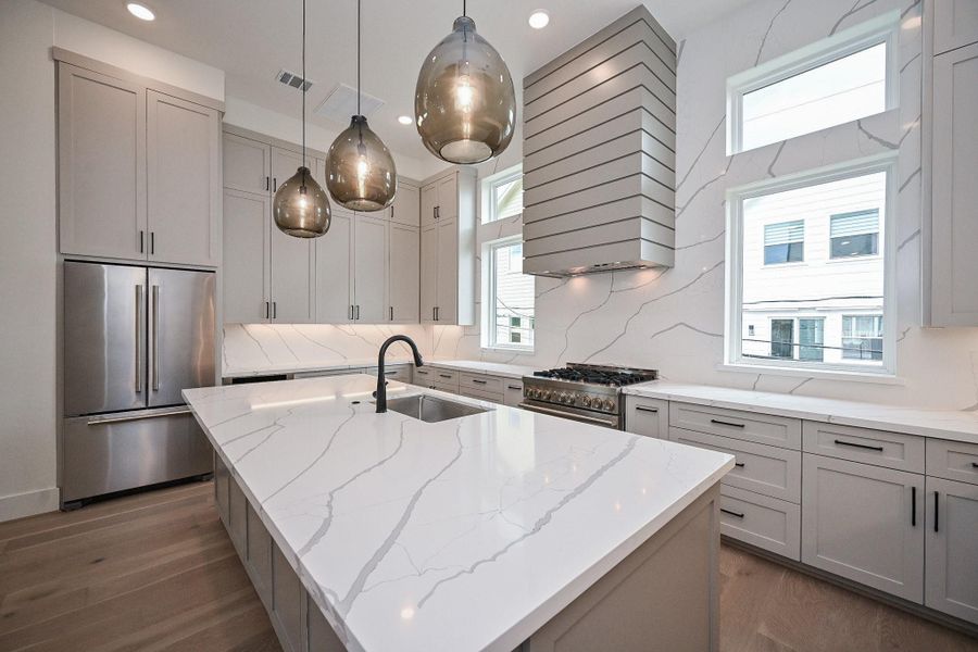 Visual Comfort Lights. Tons of Extra Storage. Custom made cabinets. Tob Knobs. Jennaire Appliances. Virtually Staged.
