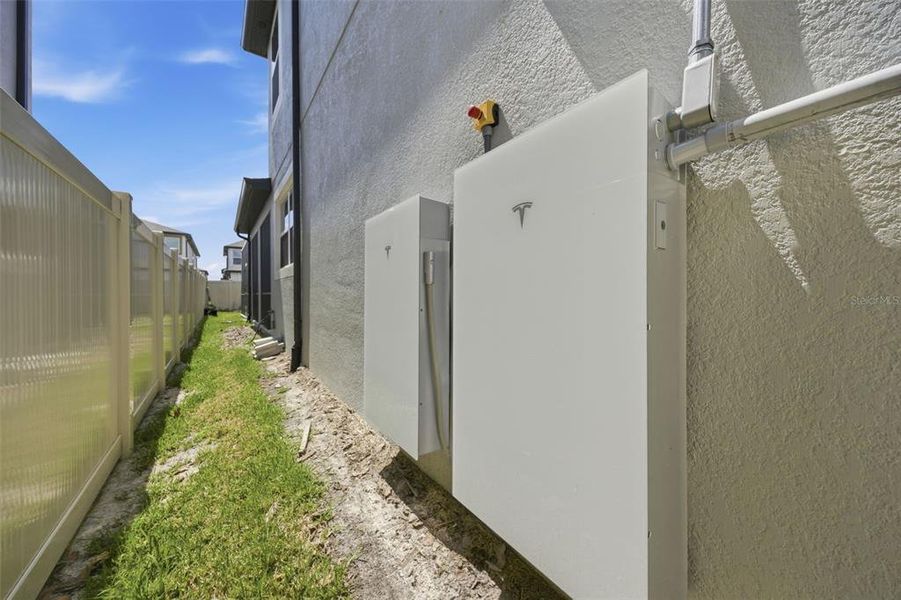 Exterior details and patio area of a home in Whispering Oaks Preserve, Wesley Chapel (Image 35). Exterior details and patio area of a home in Whispering Oaks Preserve, Wesley Chapel (Image 35).