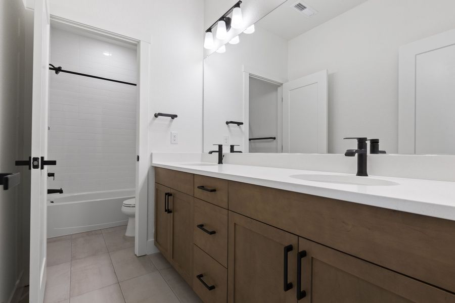 Representative furnished interior of a home built from the Journey Series - Varra by Brightland Homes in Dillon Pointe - Skyview, Broomfield (Image 18).