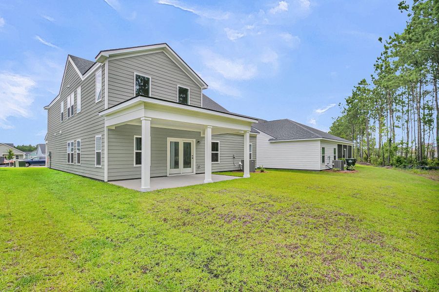 Exterior details and patio area of a home in Tea Farm, Ravenel (Image 29).
