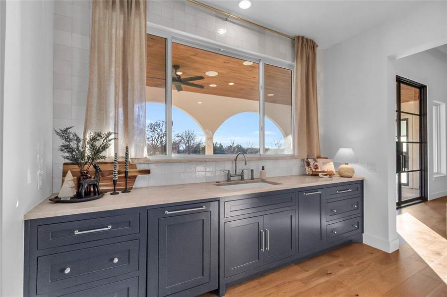 Sink area overlooking backyard views