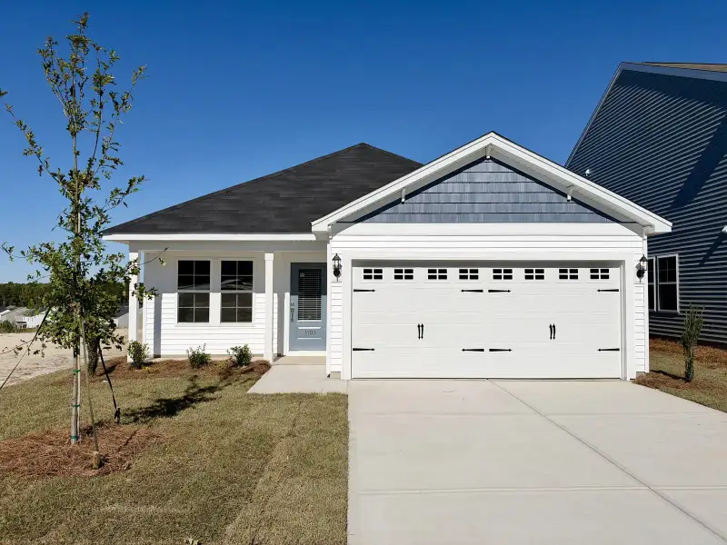 Front exterior of a new home in Ellington, Elgin, SC, highlighting curb appeal (Image 1). Front exterior of a new home in Ellington, Elgin, SC, highlighting curb appeal (Image 1).