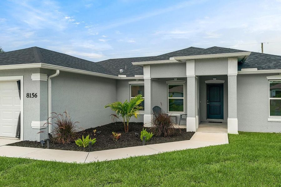 Front exterior of a new home in , Vero Beach, FL, highlighting curb appeal (Image 20). Front exterior of a new home in , Vero Beach, FL, highlighting curb appeal (Image 20).