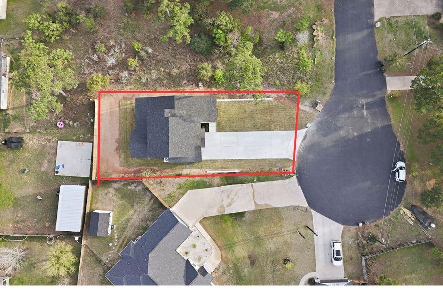 Aerial view of property and surrounding area featuring property boundaries highlighted