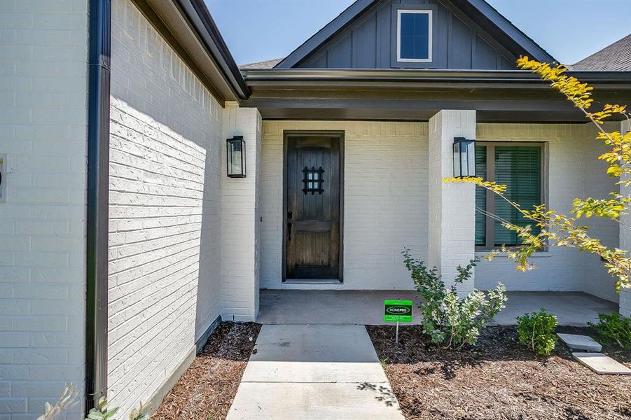 Exterior details and patio area of a home in Matthews Farm, Venus (Image 25).