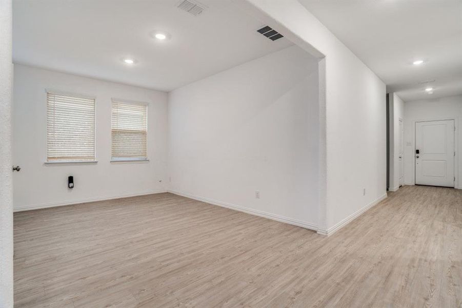 Spare room featuring light wood-style floors and recessed lighting