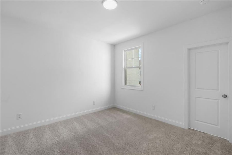Secondary bedroom with walk in closet - Pictures represent a previously built home