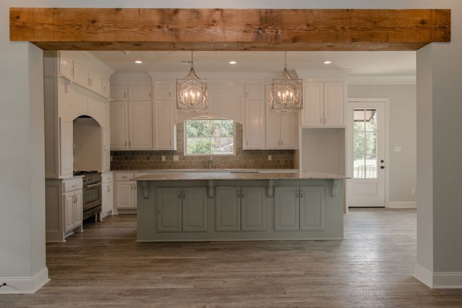 Representative furnished interior of a home built from the The Chateau French by Manuel Builders in Chapel Bend, Montgomery (Image 11).