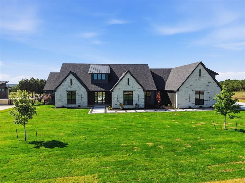 Front exterior of a new home in , Cresson, TX, highlighting curb appeal (Image 1). Front exterior of a new home in , Cresson, TX, highlighting curb appeal (Image 1).