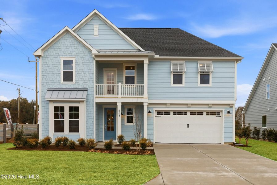 Front exterior of a new home in WyndWater, Hampstead, NC, highlighting curb appeal (Image 2). Front exterior of a new home in WyndWater, Hampstead, NC, highlighting curb appeal (Image 2).