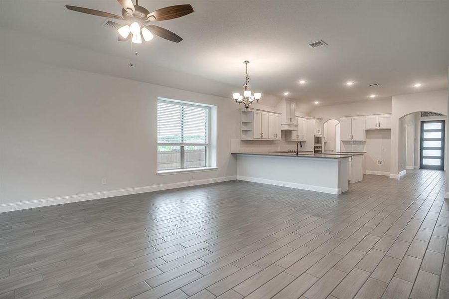 Living room open to breakfast area and kitchen