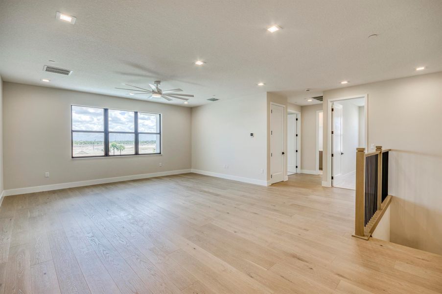 Furnished interior view inside a new home in Apex at Avenir, Palm Beach Gardens (Image 25).