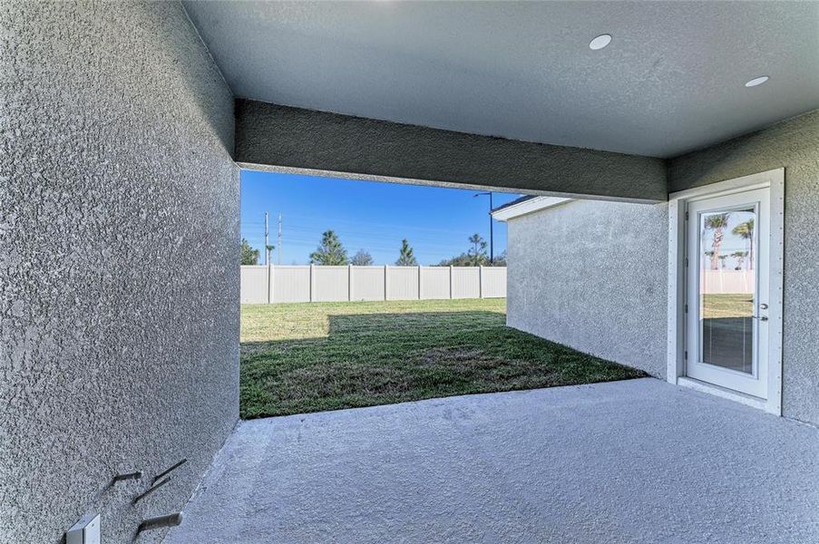 Exterior details and patio area of a home in Oakfield, Parrish (Image 3).
