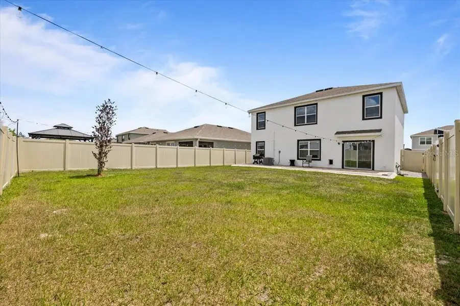 Exterior details and patio area of a home in Epperson, Wesley Chapel (Image 3).