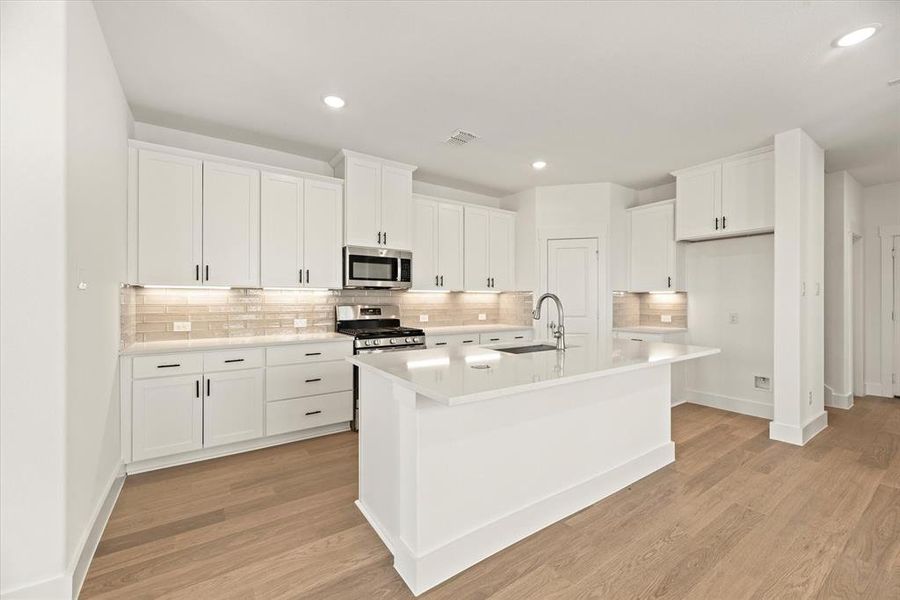 No shortage of storage space, prep space or style in this fabulous kitchen!