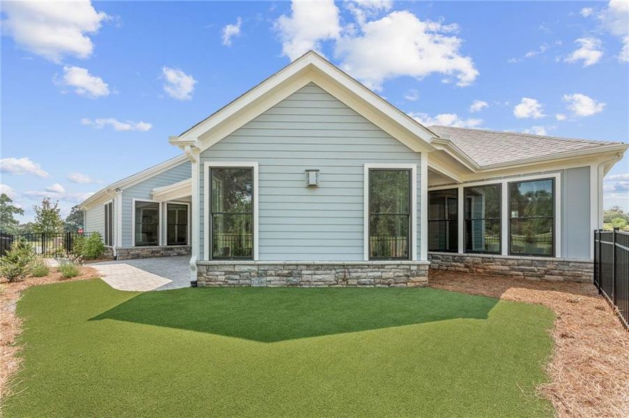 Exterior details and patio area of a home in The Courtyards at Post Road, Cumming (Image 22).