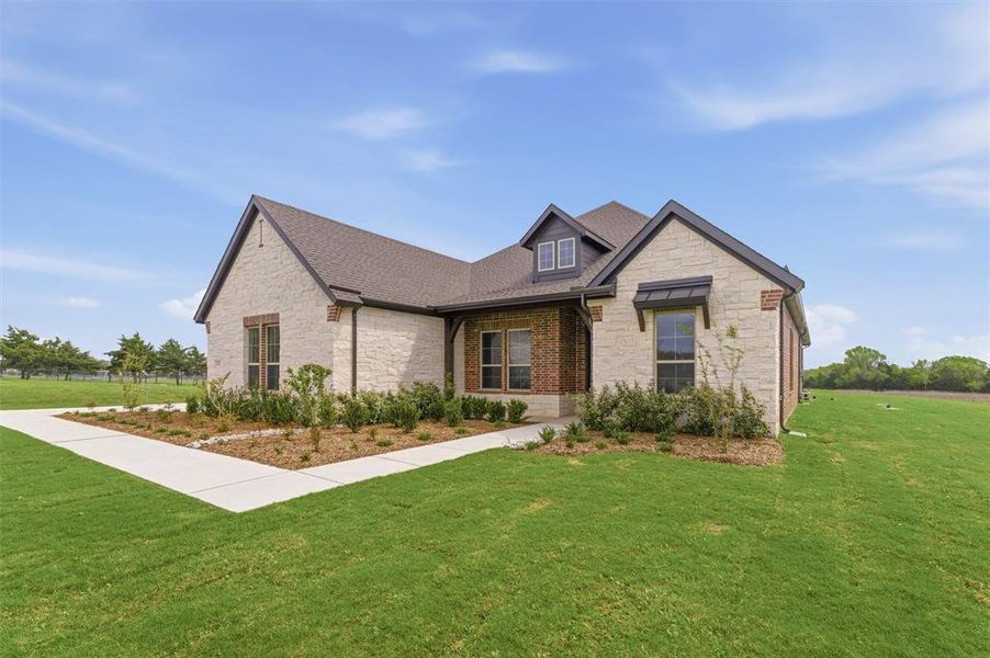 Craftsman-style home with stone siding, a front lawn, covered porch, and roof with shingles