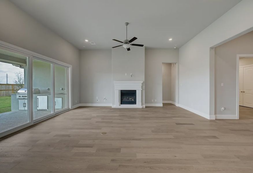 Plan 6025 great room w/ fireplace, SS doors, EOL - 5 of 21 Plan 6025 great room w/ fireplace, SS doors, EOL - 5 of 21