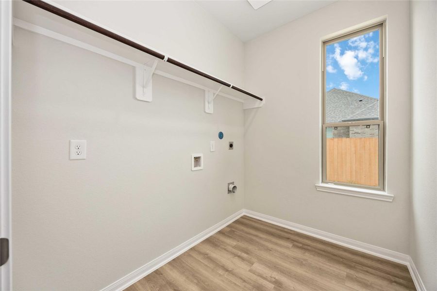 The in-house utility room provides a large space for all laundry needs, complete with washer and dryer connections, shelving and hanging rod. The in-house utility room provides a large space for all laundry needs, complete with washer and dryer connections, shelving and hanging rod.
