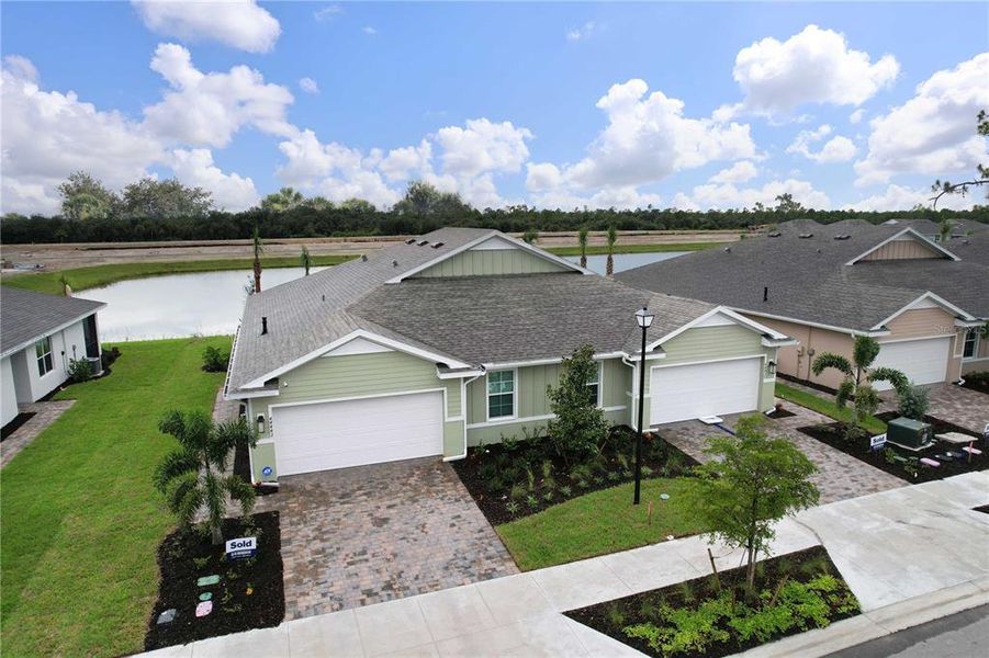Front exterior of a new home in , Punta Gorda, FL, highlighting curb appeal (Image 23).