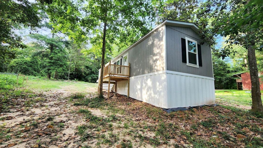 Front exterior of a new home in , Livingston, TX, highlighting curb appeal (Image 15). Front exterior of a new home in , Livingston, TX, highlighting curb appeal (Image 15).